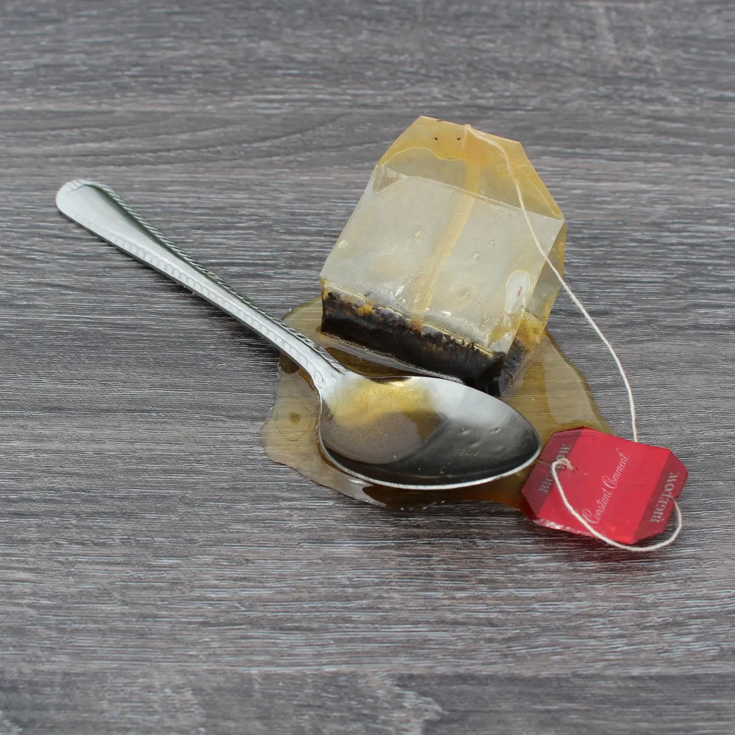 Tea Spoon and Tea Bag in Fake Spill